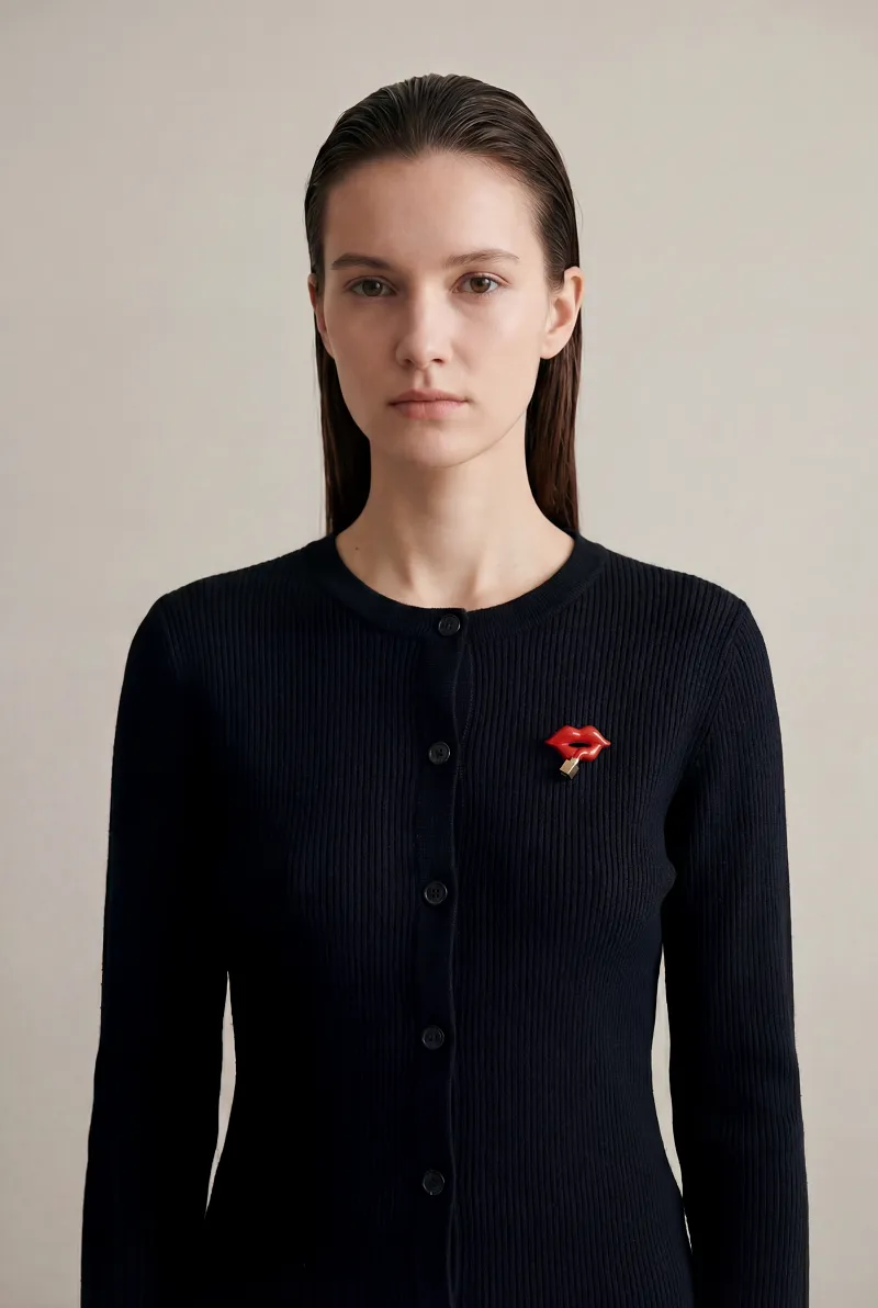 Statement brooch on cardigan