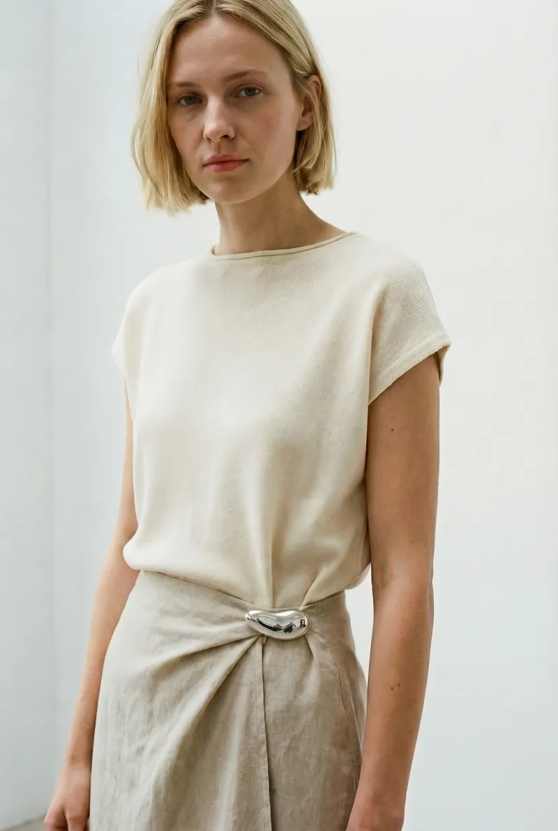 Minimalist brooch on dress